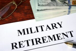 "Military retirement" written on a piece of paper. 